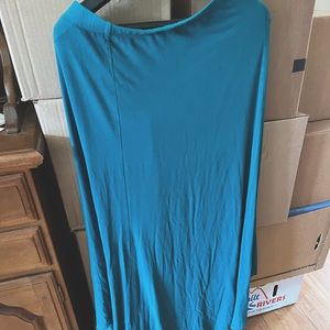 Beautiful full length maxi skirt. 95% rayon, 5% spandex.  Ample.